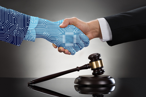 Close-up Of Two Businessman Shaking Hands In Front Of Mallet SMART CONTRACT